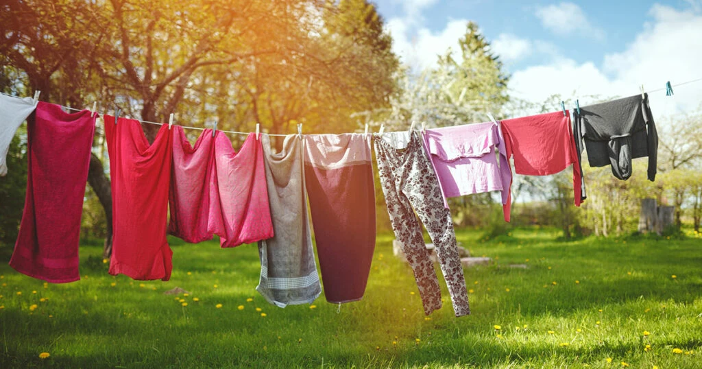 clothes hanging on a clothesline in the sunshine